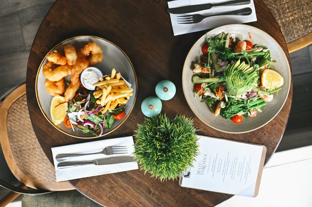 Seafood and salad dishes on a table at Matt the Thresher Birdhill