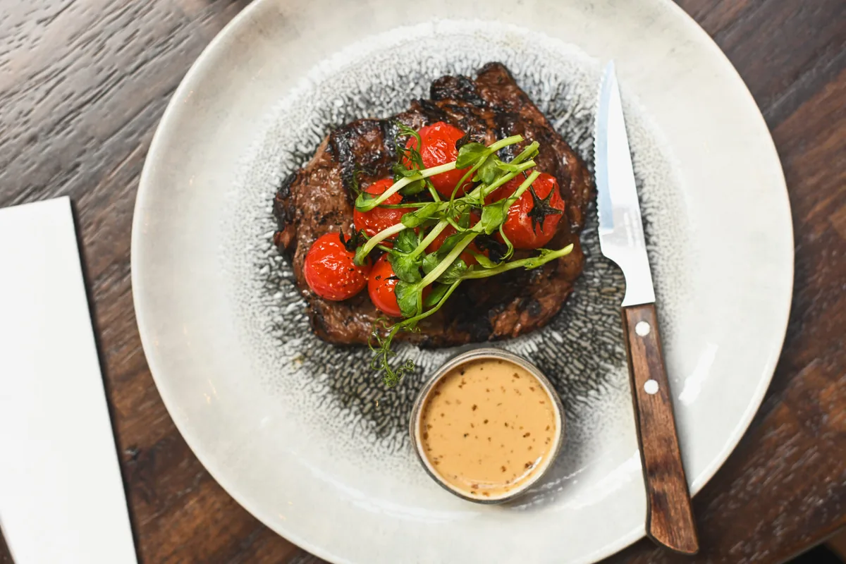 Steak with tomatoes and sauce at Matt the Thresher Julianstown